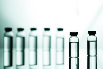Group of ampoules with a transparent medicine in medical laboratory