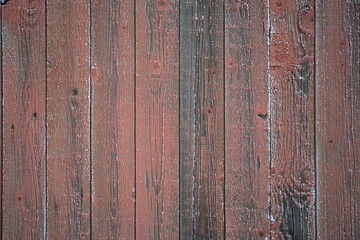 Red weathered wooden wall texture with frost