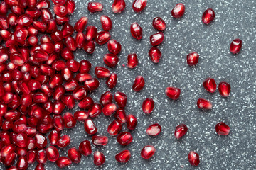 Grains of red garnet on dark background