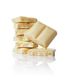 Close-up pieces of white porous chocolate bar