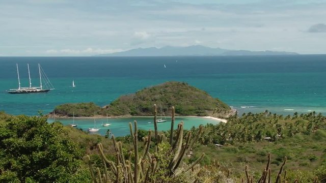 Three mast yacht sailing near Mayreau island, St Vincent and the Grenadines
