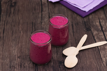 Berry smoothies in glass bowls.