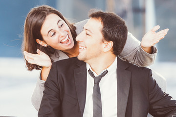 Playful Business Woman Uncovering Colleague Eyes