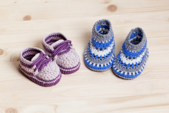 Baby Booties Crochet on wooden background