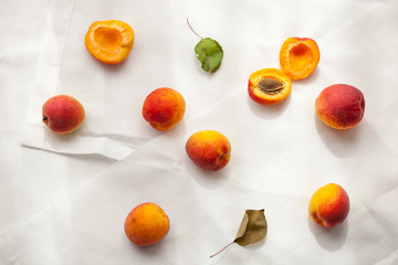 Apricots in paper bag, white background