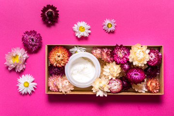 Obraz na płótnie Canvas Cosmecic cream on pink background