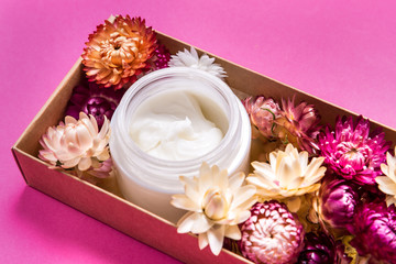 Obraz na płótnie Canvas Cosmecic cream on pink background