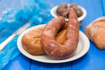 smoked portuguese sausages on white plate