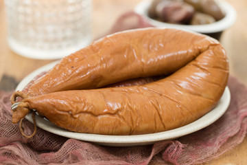 smoked portuguese sausages on white plate