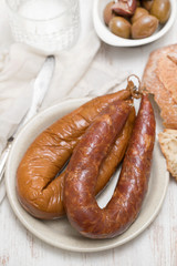 smoked portuguese sausages on white plate