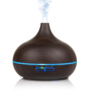 Electric wooden aroma oil diffuser isolated on white background