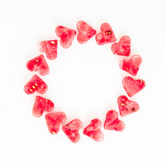 Valentine's day frame made of watermelon slice on white background. Flat lay, top view. Frame background