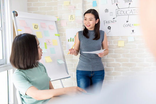 Asian Female College Student Making A Presentation In Classroom