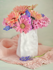 Beautiful bouquet of spring flowers in a vase on the table. Lovely bunch of flowers .