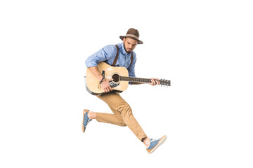 handsome young man in hat playing guitar and jumping isolated on white - Powered by Adobe