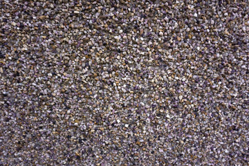 Small stones texture, road, asphalt background, gray pattern fon, wall construction, non-colored cement footage, small crumb background .