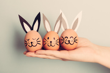 Three little Easter bunnies made from an egg