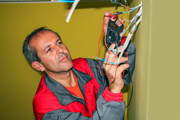 Electrician Using a Digital Multimeter