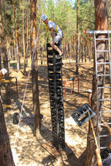 Young Man Climbs High Extreme wide