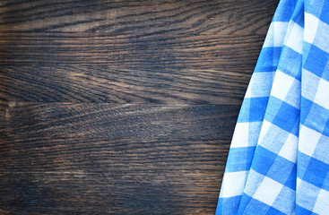 Napkin on wooden background . Top view