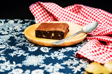 Chocolate Brownie cake on a dark plate