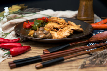 wok fried chicken stir fry with sweet peppers and chinese vegetables