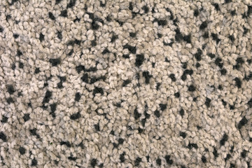 The texture of the carpet with a pile of brown