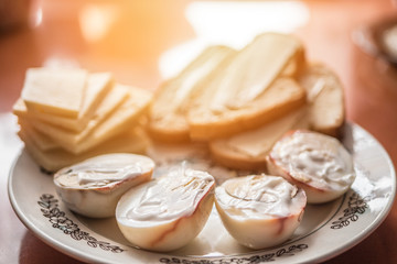 Delicious homemade breakfast with eggs, cheese and bread