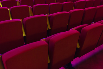 Red seats in cinema, theater, concert hall.