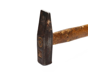 Old rusty metal hammer with wooden handle, isolated on white