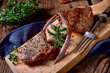 Grilled lamb chops an old board