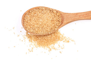 brown sugar in wooden spoon isolated on white background. Top view. Flat lay