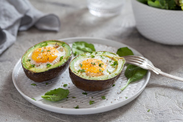 Healthy breakfast. Avocado stuffed with eggs