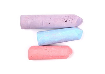 Colorful chalks isolated on white background, top view