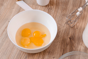 Fresh egg yolks in a porcelain bowl