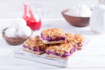Homemade shortcrust fruit pie with crumble on white background. Jam Tart Pieces