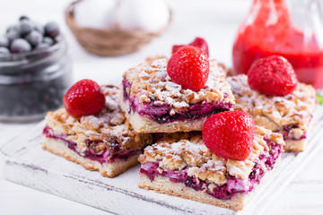 Homemade shortcrust fruit pie with crumble on white background - homemade pastry with strawberry