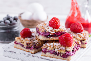 Homemade shortcrust fruit pie with crumble on white background - homemade pastry with strawberry