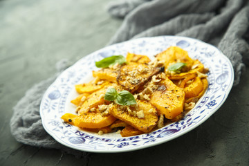 Baked pumpkin with honey glaze and nuts