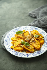 Baked pumpkin with honey glaze and nuts