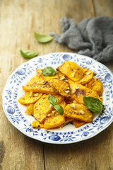 Baked pumpkin with honey glaze and nuts