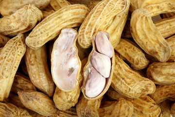 close up of peeled peanut, peanuts background.