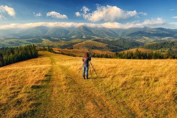 autumn morning. dawn in the Carpathian mountains. photographer, taking off the dawn. man in the mountains