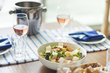 Restaurant table set with glasses, napkins and cutlery