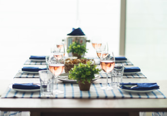 Restaurant table set with glasses, napkins and cutlery
