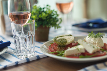 Restaurant table set with glasses, napkins and cutlery