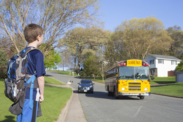 Boy waiting for his school bus