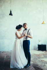 Happy couple in love hugging and smiling at dance