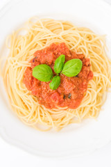 tatsty fresh spaghetti with tomato sauce fresh basil isolated on white background