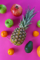 exotic fruits on a pink background